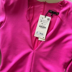 hot pink body suit, zipper back, snap closure in crotch (2 adjustments)